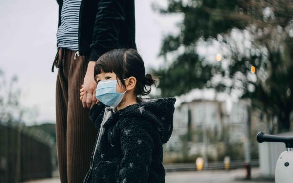 Little girl wearing face mask