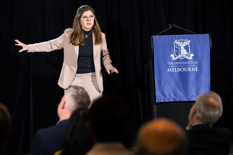 Betsey Stevenson presenting a lecture on stage