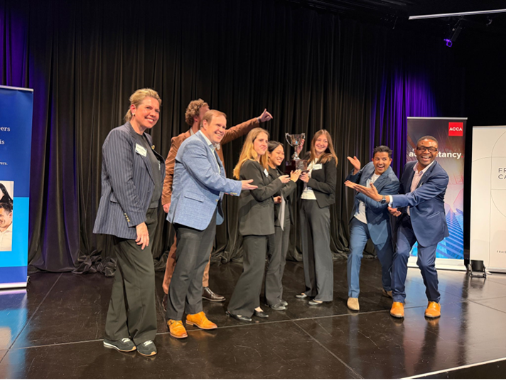 The winning team with their trophy and the judging panel. 