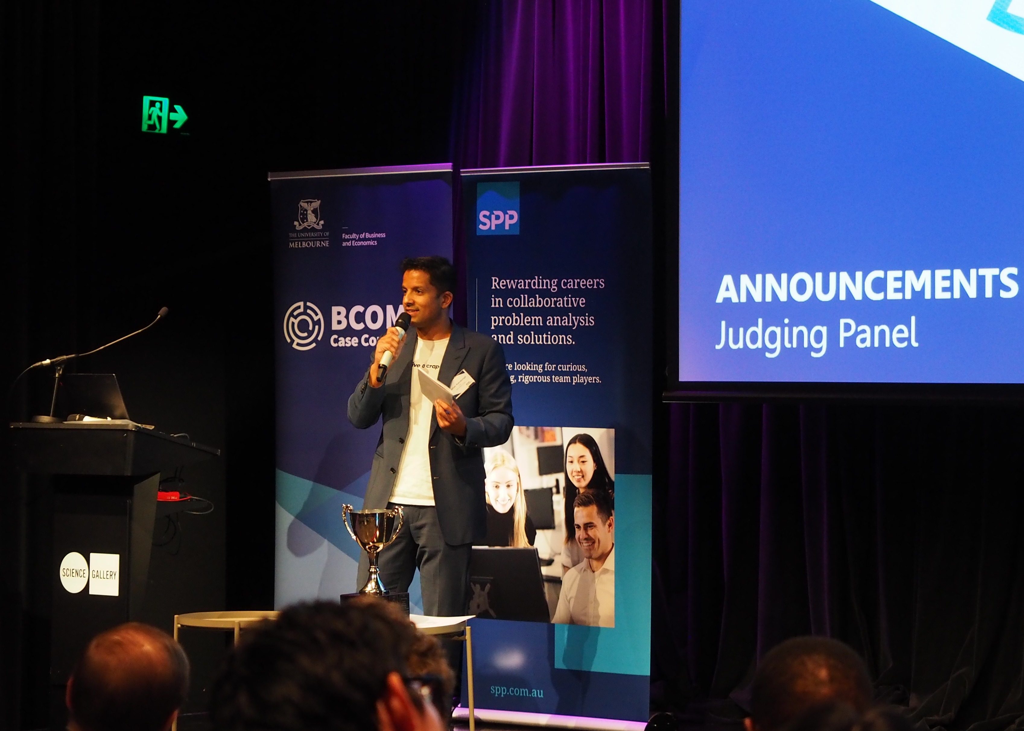 Jehan Ratnatunga (WGAC Co-Founder) stood on stage and speaking to the audience.