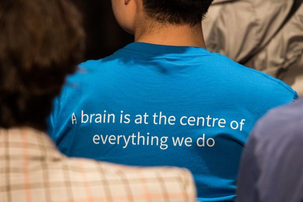 Back of a shirt that reads 'A brain is at the centre of everything we do