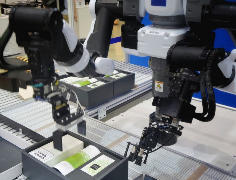 A robot is assembling product in the manufacturing industry