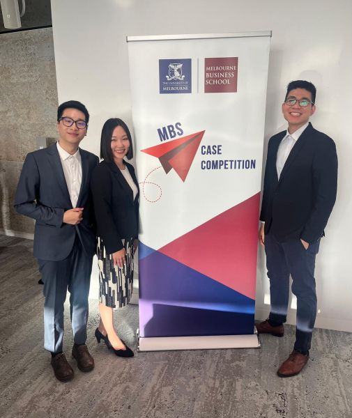 Team TradeWise with MBS Case Comp banner during the preliminary round