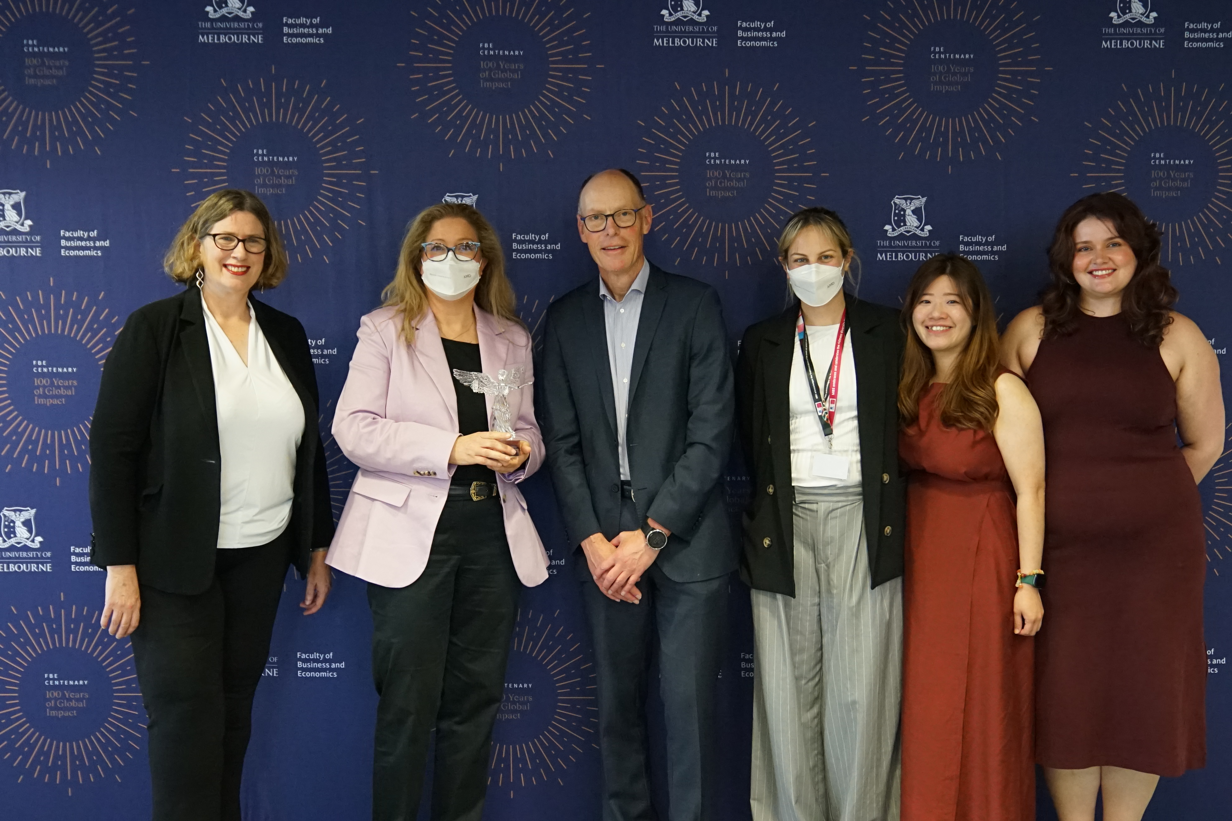 The DNA team of 4, posing with their award