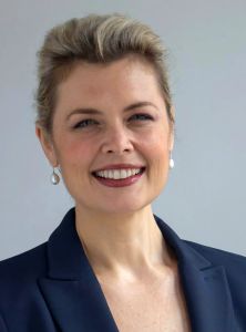 A woman wearing a blue suit