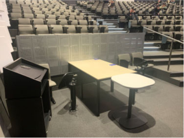 accessible seating on the front row obstructed by tables in Copland Theatre