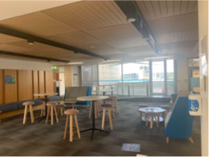High tables and chairs across Level 4 of the Faculty of Business and Economics Building