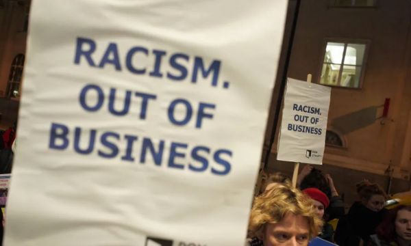 racism out of business banner
