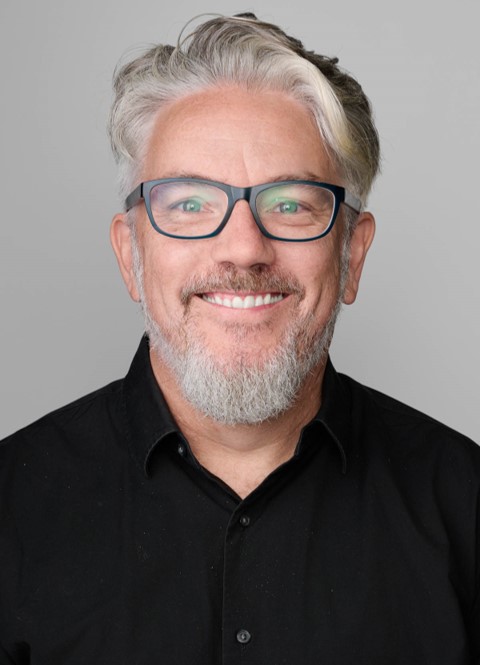 A man wearing black business shirt