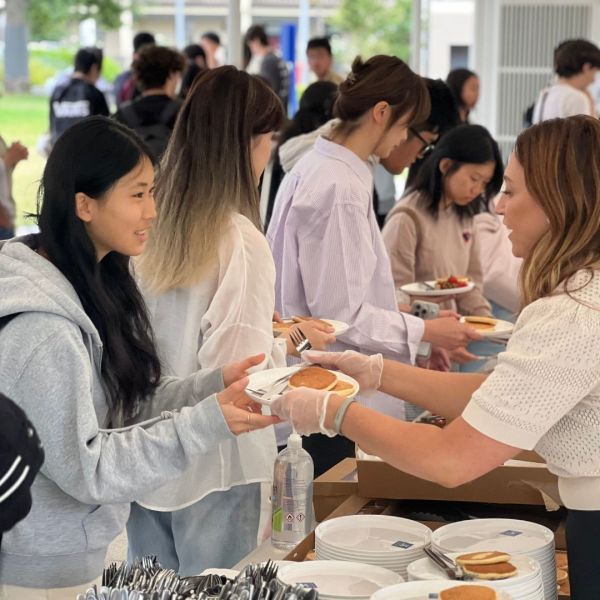 Students getting pancakes at the Student Brunch