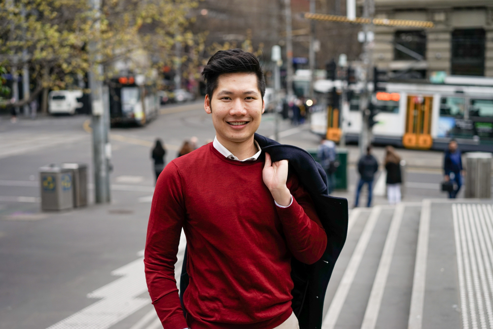 Tyler Nguyen in Melbourne with tram in the background