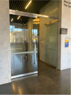 One side of a non-automatic door kept open in the Spot building